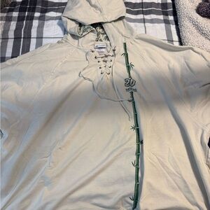 Disney Parks Animal Kingdom Cream Hoodie with Green Pattern